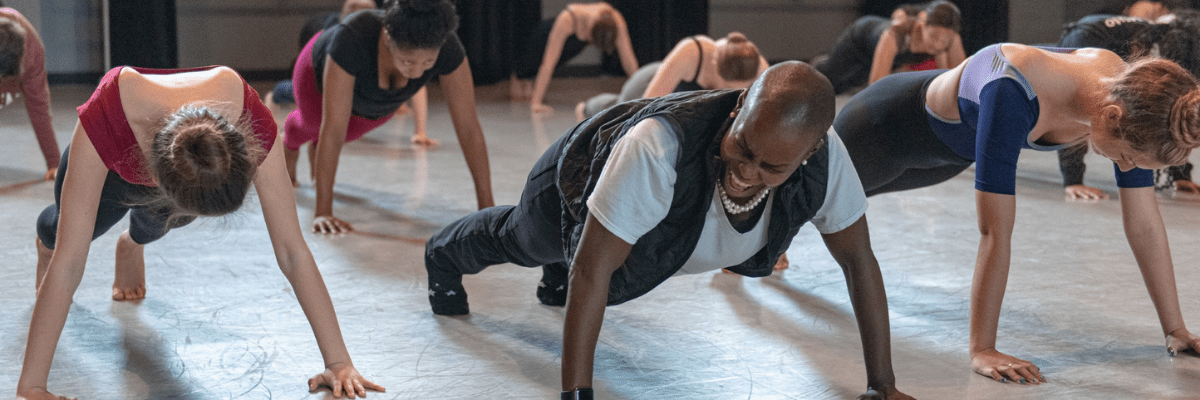 dancers in push up position