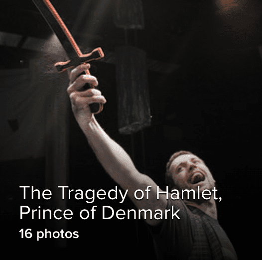 man holding sword in the air triumphantly