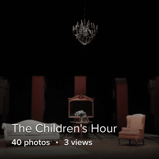 a set with two colonial chairs and a large chandelier