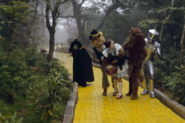 Wizard of Oz characters walking down the Yellow Brick Road.