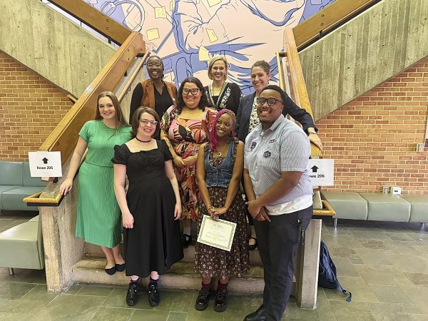 Voice students and faculty on steps in Rowe Arts