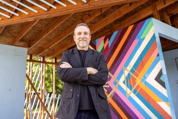 Marc Manack in front of his structure, The People's Porch.