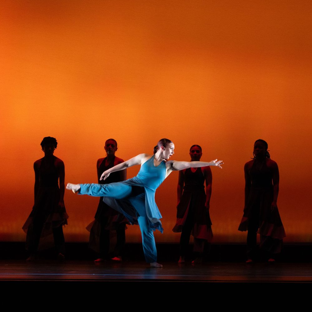 Keegan performing in front of group of dancers